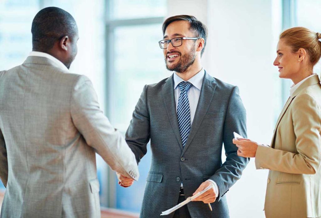 Partnering image of business people greeting each other